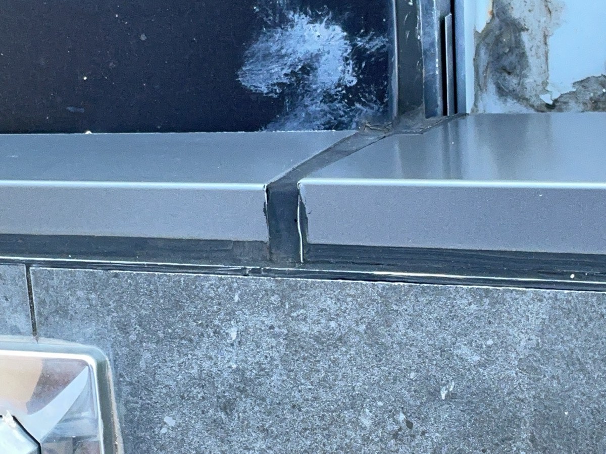 Caulking to capping, recorded during a defect investigation in Box Hill